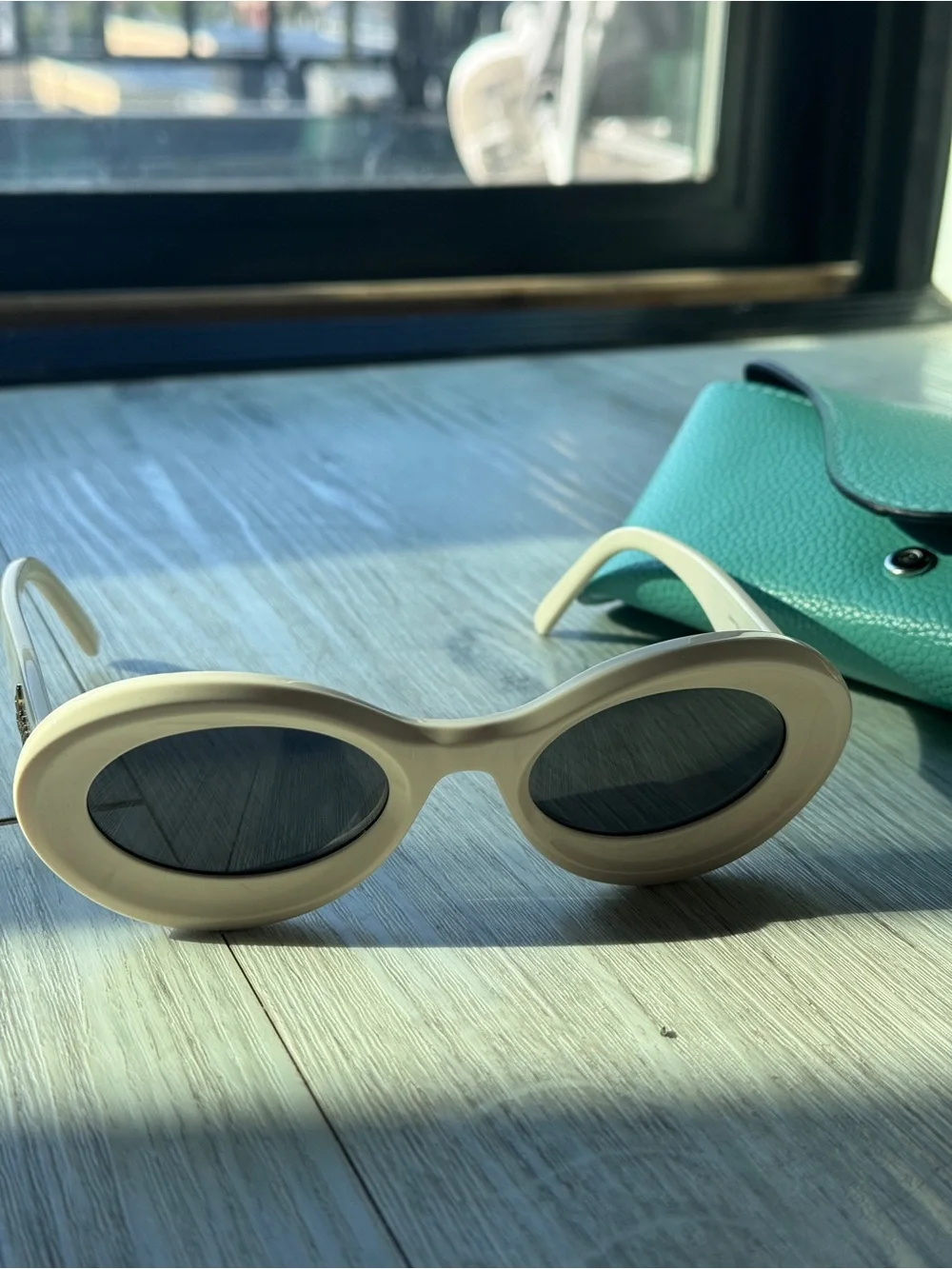 Loewe Ivory Oval Sunglasses with Dark Lenses
